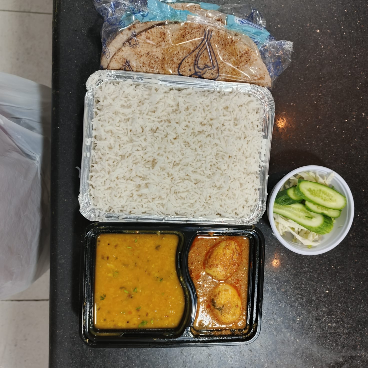 Compartment meal with dal and curry